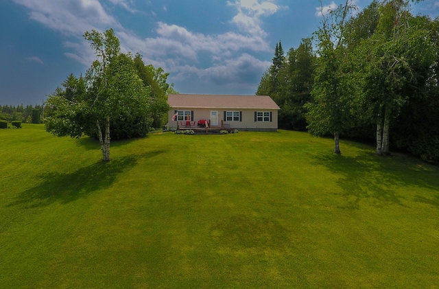 1817 Lindburgh Ln, Cheboygan, MI 49721 - single story home with a front yard and a deck