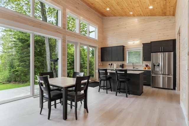 2960 W US-23 Hwy, Cheboygan, MI 49721 - dining room with high vaulted ceiling, wood ceiling, wooden walls, recessed lighting, and light wood-type flooring