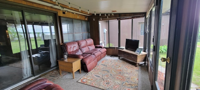 3211 S Partridge Point Rd, Alpena, MI 49707 - sunroom / solarium featuring carpet floors and healthy amount of natural light