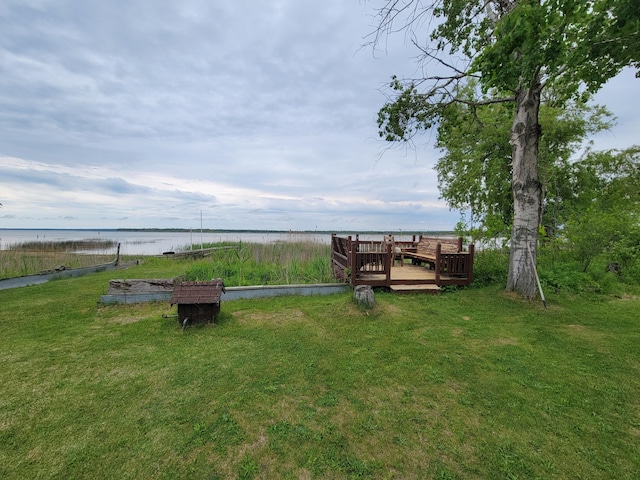 3211 S Partridge Point Rd, Alpena, MI 49707 - view of green lawn featuring a deck with water view
