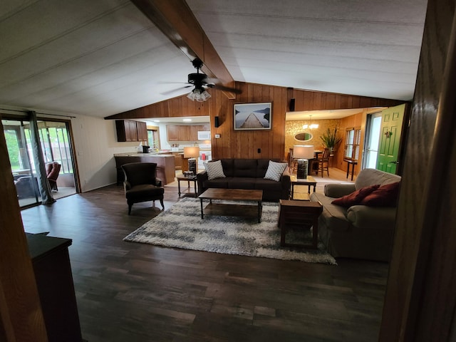 3211 S Partridge Point Rd, Alpena, MI 49707 - living room with wood walls, wood finished floors, and a ceiling fan