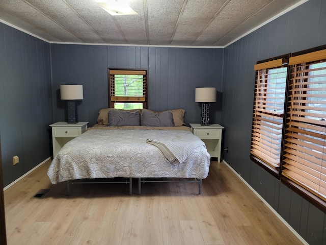 3211 S Partridge Point Rd, Alpena, MI 49707 - bedroom with wood finished floors