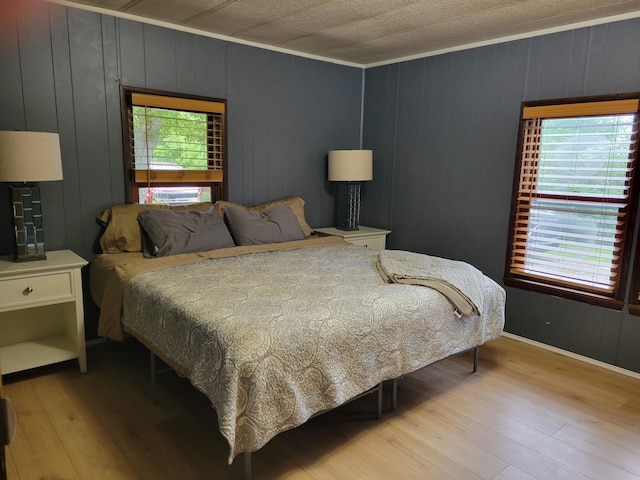 3211 S Partridge Point Rd, Alpena, MI 49707 - bedroom with wood finished floors and baseboards
