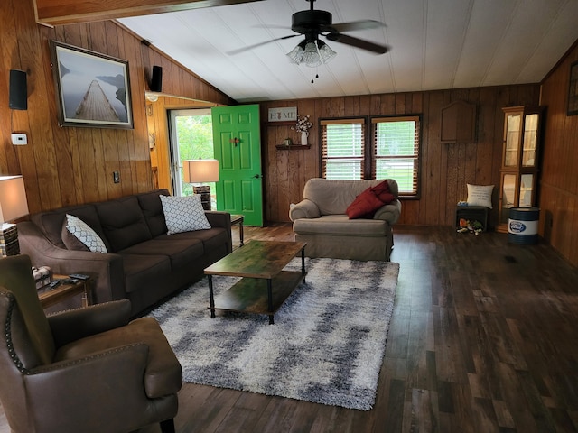 3211 S Partridge Point Rd, Alpena, MI 49707 - living room with ceiling fan, vaulted ceiling, wooden walls, and wood finished floors