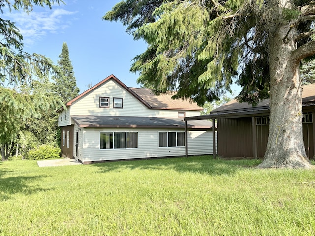 7770 Klein Rd, Hillman, MI 49746 - rear view of property featuring a lawn