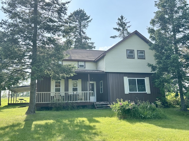 7770 Klein Rd, Hillman, MI 49746 - view of front facade featuring covered porch and a front lawn
