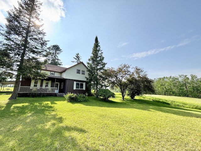 7770 Klein Rd, Hillman, MI 49746 - view of grassy yard with covered porch