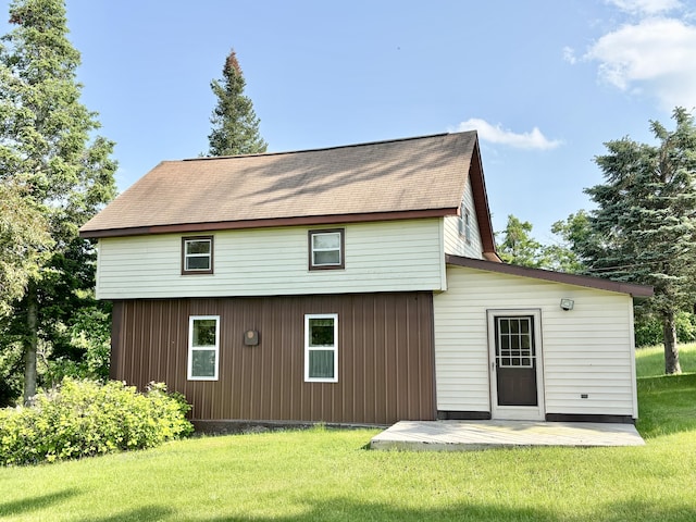 7770 Klein Rd, Hillman, MI 49746 - rear view of house with a yard and roof with shingles