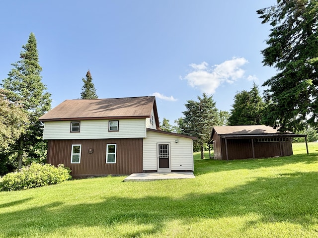 7770 Klein Rd, Hillman, MI 49746 - rear view of property featuring a yard and a patio