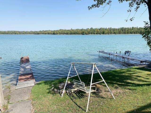 9319 Blue Horizon Rd, Presque Isle, MI 49777 - dock area featuring a water view