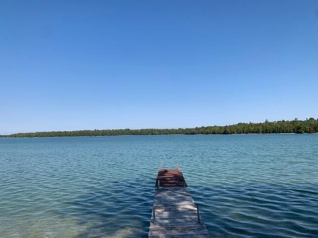 9319 Blue Horizon Rd, Presque Isle, MI 49777 - dock area featuring a water view