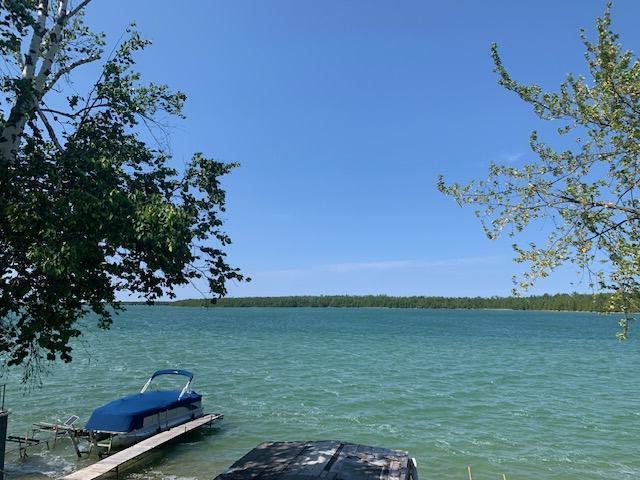 9319 Blue Horizon Rd, Presque Isle, MI 49777 - water view featuring a boat dock