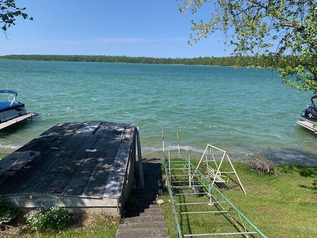 9319 Blue Horizon Rd, Presque Isle, MI 49777 - dock area featuring a water view