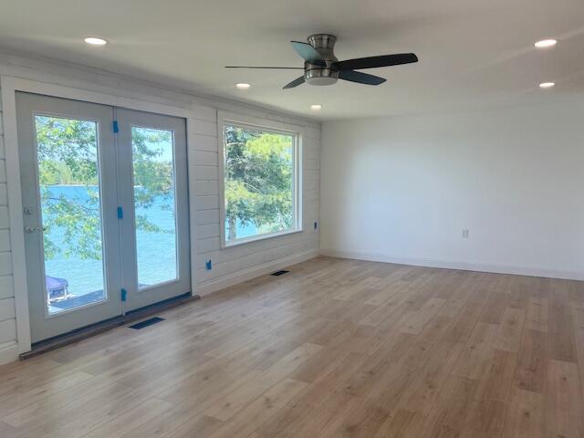 9319 Blue Horizon Rd, Presque Isle, MI 49777 - empty room with light wood-type flooring, a ceiling fan, and recessed lighting