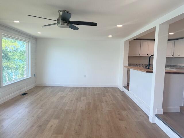 9319 Blue Horizon Rd, Presque Isle, MI 49777 - unfurnished living room with light wood-type flooring, recessed lighting, and a ceiling fan