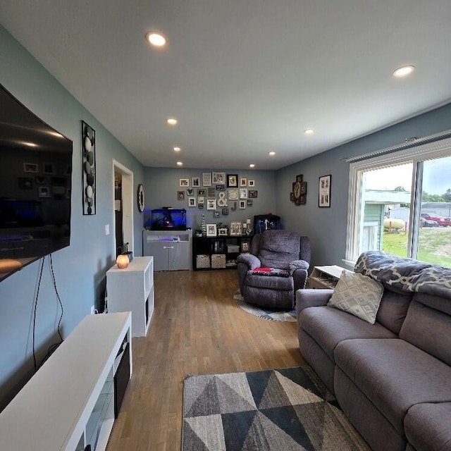 510 W Baldwin St, Alpena, MI 49707 - living area with recessed lighting and wood finished floors