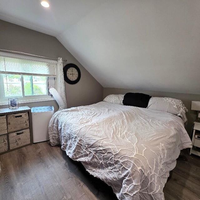 510 W Baldwin St, Alpena, MI 49707 - bedroom featuring wood finished floors and vaulted ceiling