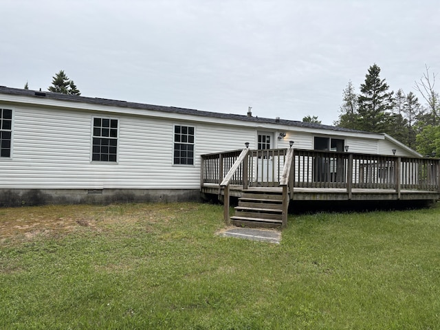 348 Lake Winyah Rd, Alpena, MI 49707 - back of property with crawl space, a deck, and a lawn