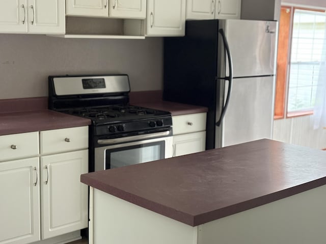 348 Lake Winyah Rd, Alpena, MI 49707 - kitchen with stainless steel appliances, dark countertops, and healthy amount of natural light