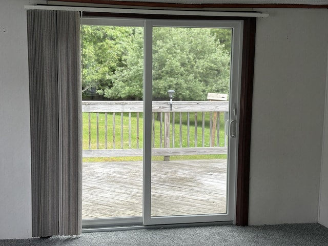 348 Lake Winyah Rd, Alpena, MI 49707 - doorway to outside featuring healthy amount of natural light and carpet