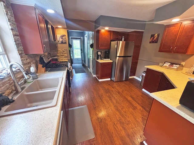 5514 N Bay Ct, Presque Isle, MI 49777 - kitchen with appliances with stainless steel finishes, dark wood-type flooring, recessed lighting, and tasteful backsplash