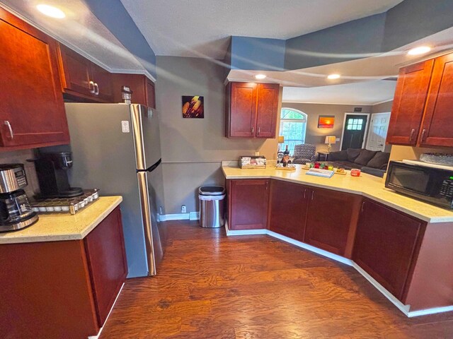 5514 N Bay Ct, Presque Isle, MI 49777 - kitchen featuring black microwave, dark wood-style flooring, freestanding refrigerator, light countertops, and recessed lighting