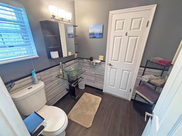5514 N Bay Ct, Presque Isle, MI 49777 - bathroom with wood finished floors and a chandelier