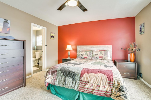 5514 N Bay Ct, Presque Isle, MI 49777 - carpeted bedroom with ensuite bathroom and a ceiling fan