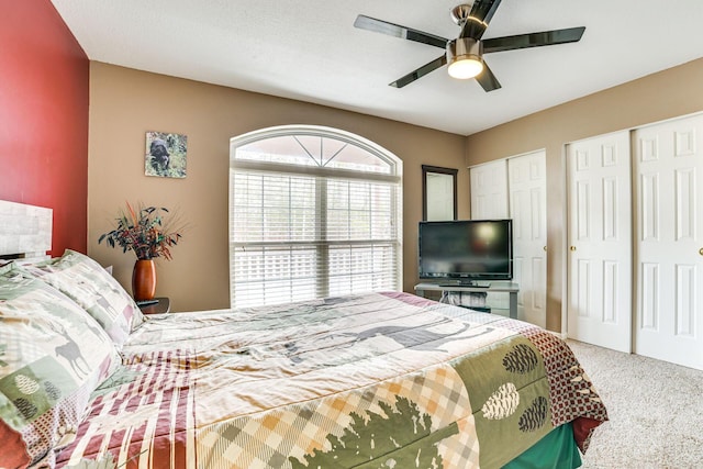 5514 N Bay Ct, Presque Isle, MI 49777 - bedroom featuring two closets, carpet flooring, and ceiling fan