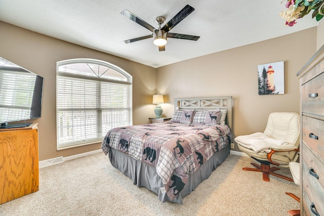 5514 N Bay Ct, Presque Isle, MI 49777 - carpeted bedroom with baseboards and ceiling fan
