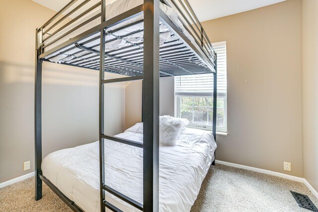 5514 N Bay Ct, Presque Isle, MI 49777 - carpeted bedroom with baseboards