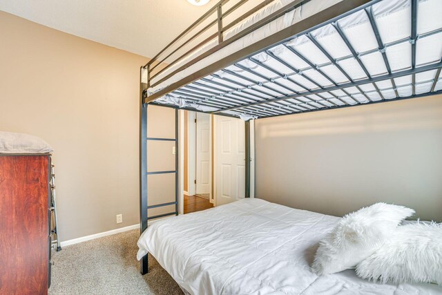 5514 N Bay Ct, Presque Isle, MI 49777 - carpeted bedroom with baseboards