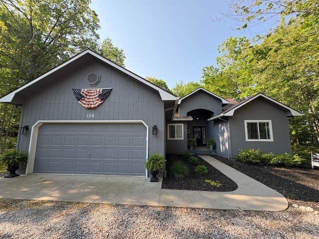 108 Bourbon St, Roscommon, MI 48653 - ranch-style home with gravel driveway and an attached garage
