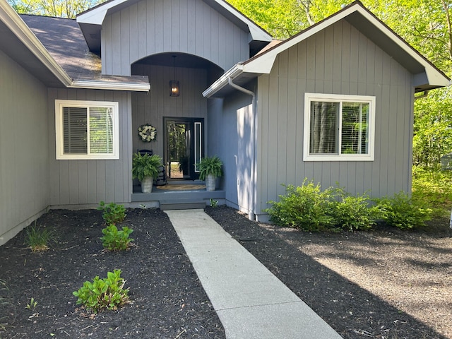 108 Bourbon St, Roscommon, MI 48653 - doorway to property with a shingled roof