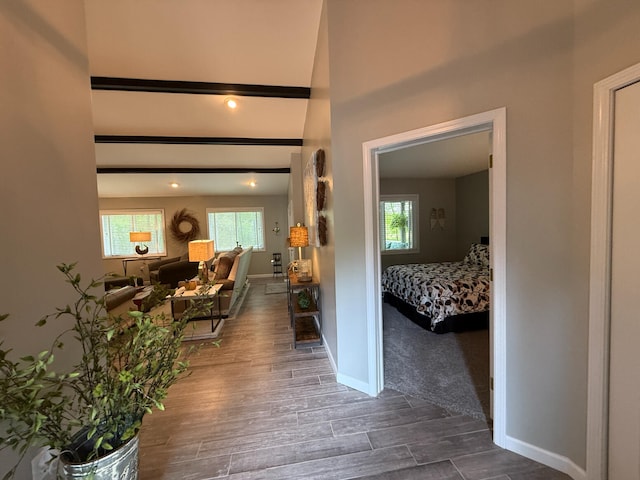 108 Bourbon St, Roscommon, MI 48653 - hallway featuring baseboards and wood finished floors