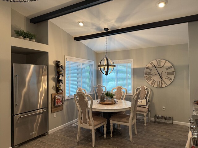 108 Bourbon St, Roscommon, MI 48653 - dining space with dark wood-style floors and a chandelier