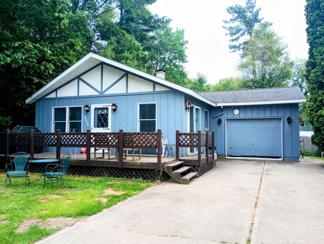 223 Mallard Ave, Houghton Lake, MI 48629 - single story home featuring a garage, driveway, a chimney, a deck, and roof with shingles