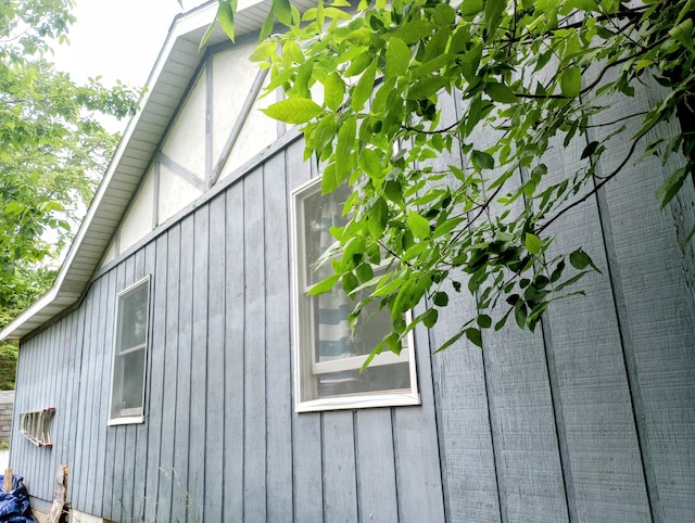 223 Mallard Ave, Houghton Lake, MI 48629 - view of side of property featuring board and batten siding