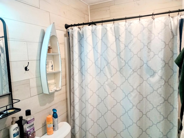 223 Mallard Ave, Houghton Lake, MI 48629 - full bath featuring wooden walls and a shower with shower curtain