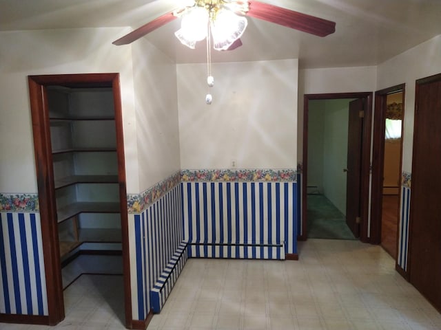 1427 E Lacomb Rd, Alpena, MI 49707 - staircase featuring a ceiling fan and tile patterned floors