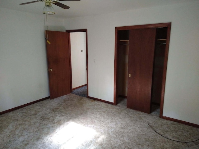 1427 E Lacomb Rd, Alpena, MI 49707 - unfurnished bedroom featuring carpet, a closet, and a ceiling fan