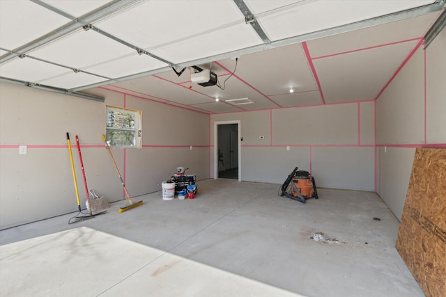 706 Colfax St, Cadillac, MI 49601 - garage featuring a garage door opener