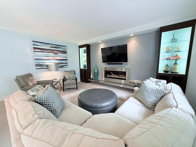 129 Ethel Dr, Roscommon, MI 48653 - living room featuring carpet, a glass covered fireplace, and recessed lighting