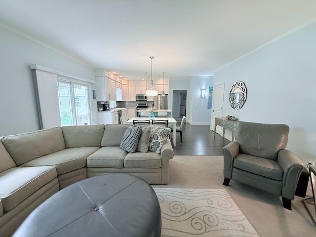 129 Ethel Dr, Roscommon, MI 48653 - living area featuring ornamental molding and dark wood finished floors