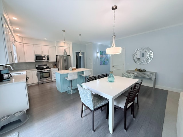 129 Ethel Dr, Roscommon, MI 48653 - dining room featuring dark wood-style floors, ornamental molding, and recessed lighting