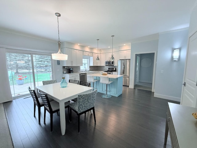 129 Ethel Dr, Roscommon, MI 48653 - dining area with dark wood-type flooring and plenty of natural light