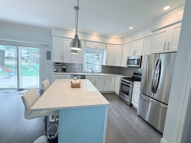 129 Ethel Dr, Roscommon, MI 48653 - kitchen featuring stainless steel appliances, plenty of natural light, dark wood-type flooring, tasteful backsplash, and recessed lighting