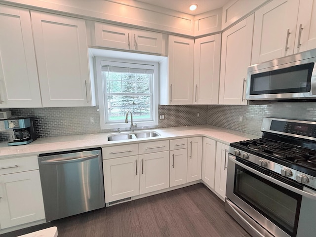 129 Ethel Dr, Roscommon, MI 48653 - kitchen with stainless steel appliances, light countertops, and white cabinets