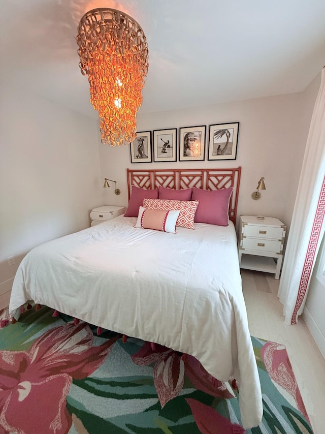 129 Ethel Dr, Roscommon, MI 48653 - bedroom with a chandelier