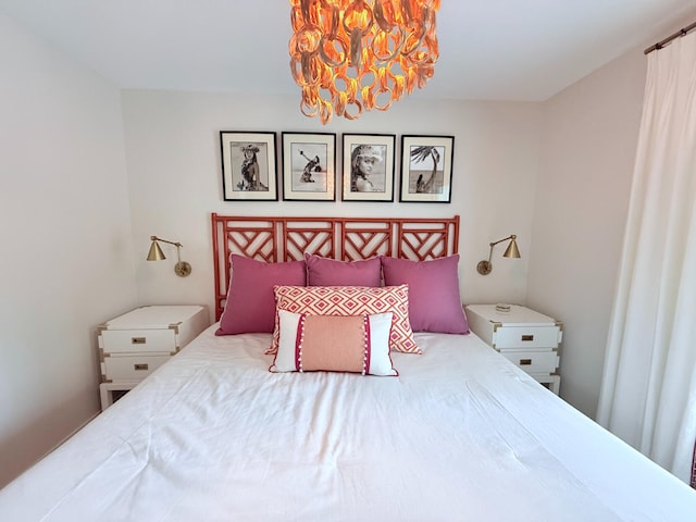 129 Ethel Dr, Roscommon, MI 48653 - bedroom with a chandelier